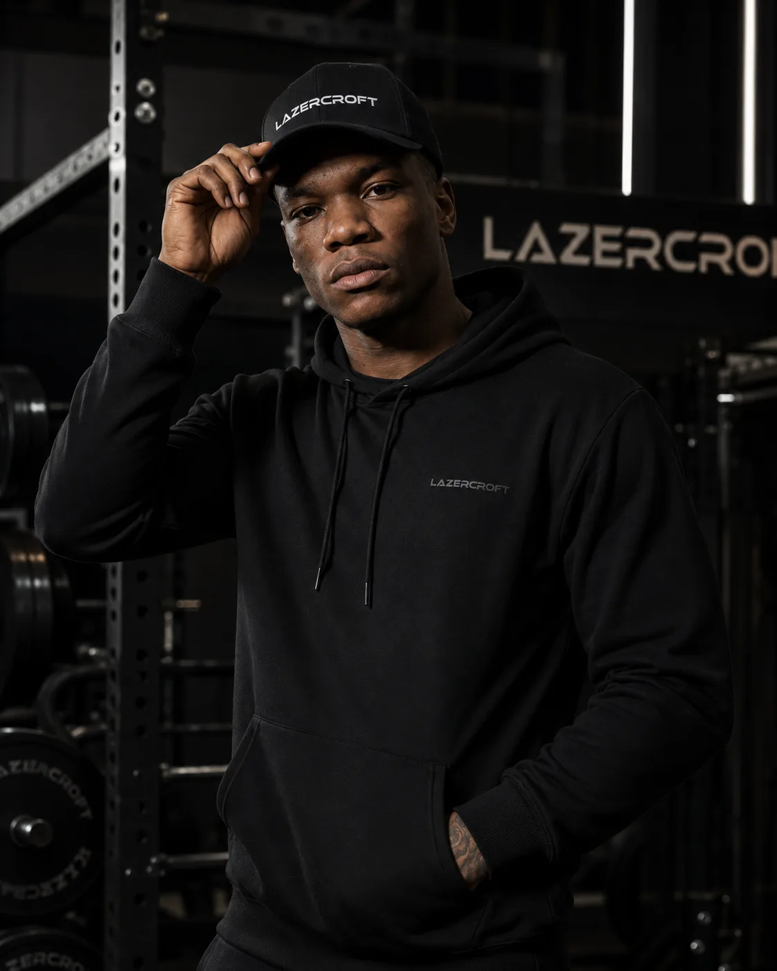 Athlete wearing a black Lazercroft hoodie in a gym